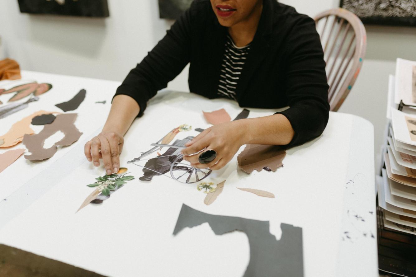 Tya Anthony working on a collage in her studio